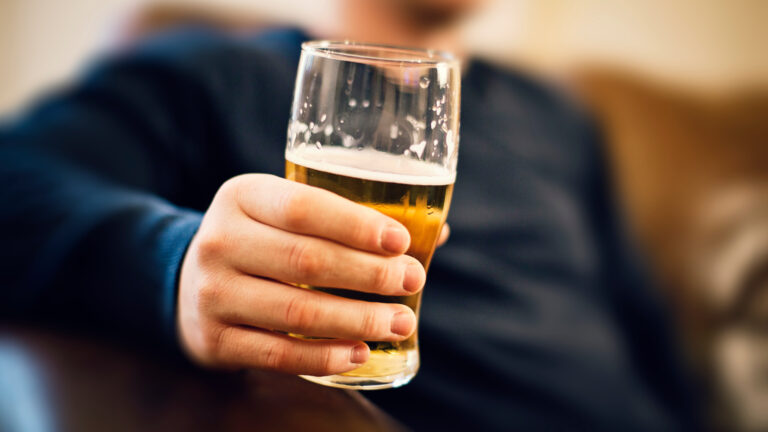 Man drinking pint of beer