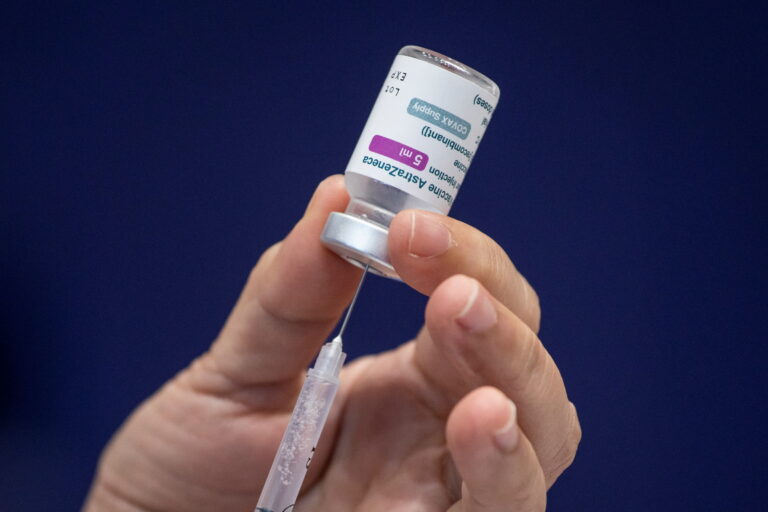 FILE PHOTO: Healthcare workers get COVID-19 vaccine in Metro Manila