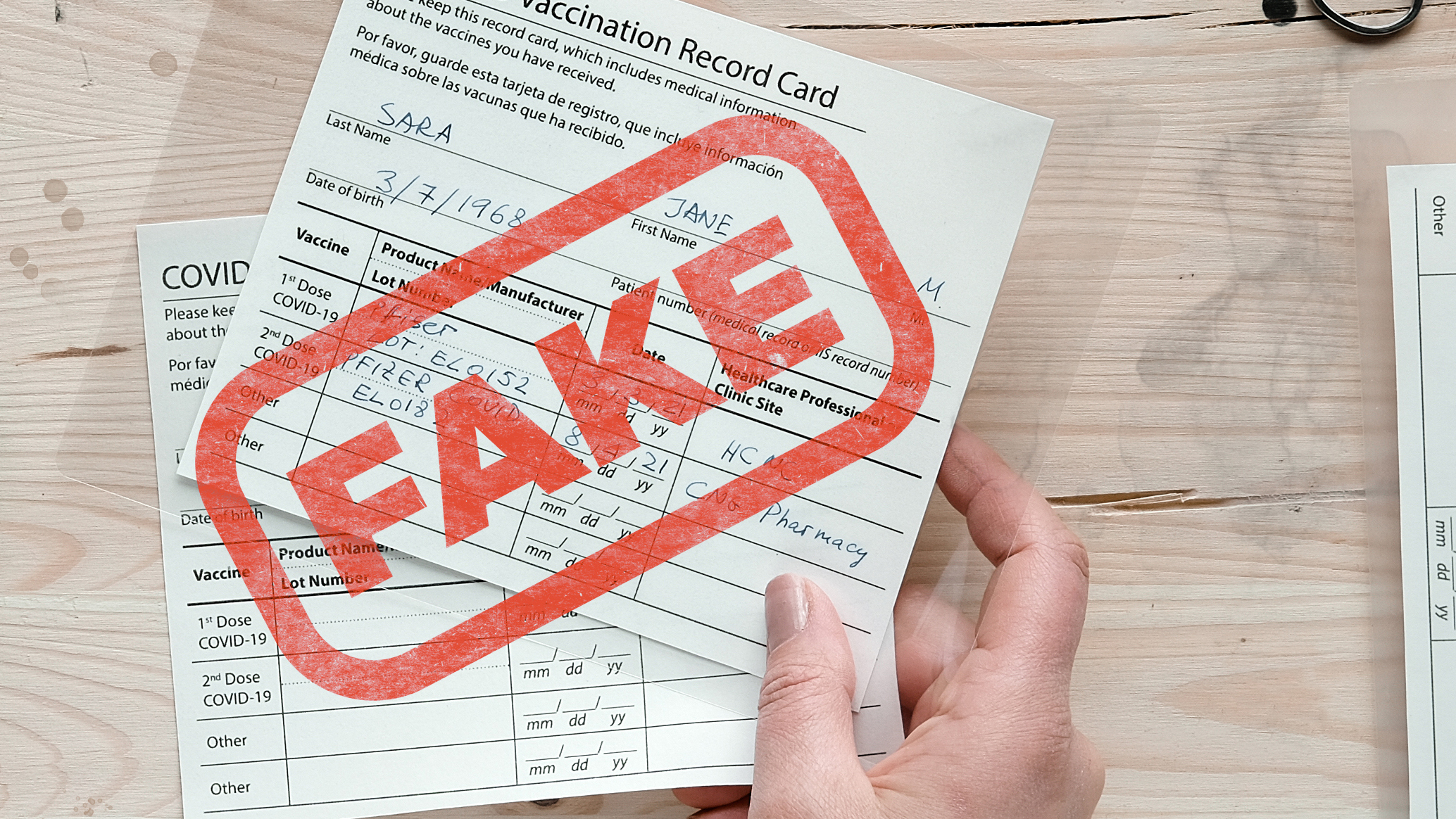 Fake covid vaccination record card. Forgery of health certificate confirming vaccinations against covid-19